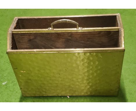 A VINTAGE BRASS MAGAZINE RACK 
