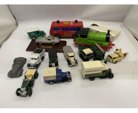 A MIXED LOT TO INCLUDE A METAL THOMAS THE TANK THE ENGINE TRAIN "PERCY", A TIN FIRE DEPT ENGINE, ADVERTISING TRANSPORTATION V