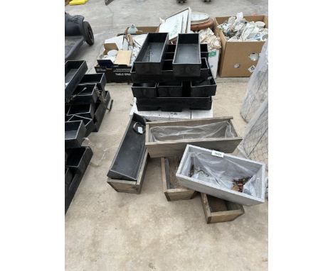 AN ASSORTMENT OF SMALL TROUGH PLANTERS 
