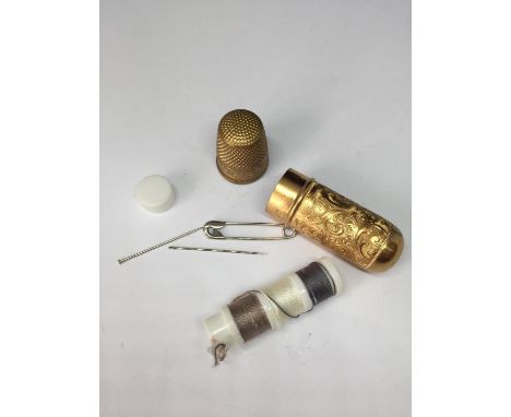 A VINTAGE TRAVEL SEWING KET 