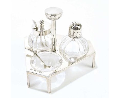 DR CHRISTOPHER DRESSER FOR HUKIN &amp; HEATH; a Victorian hallmarked silver and cut glass cruet, on triangular stand with six