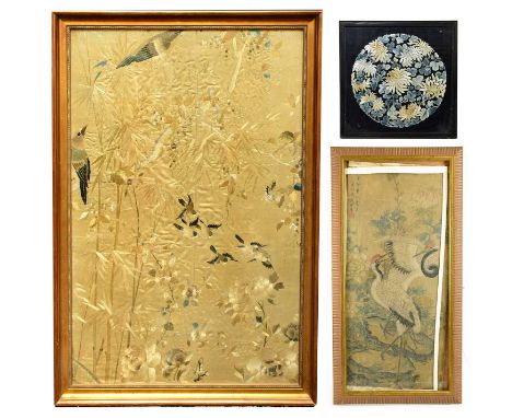 A 19th century Chinese silk work panel decorated with birds and flowers against a gold coloured ground, 58.5 x 90cm, framed a