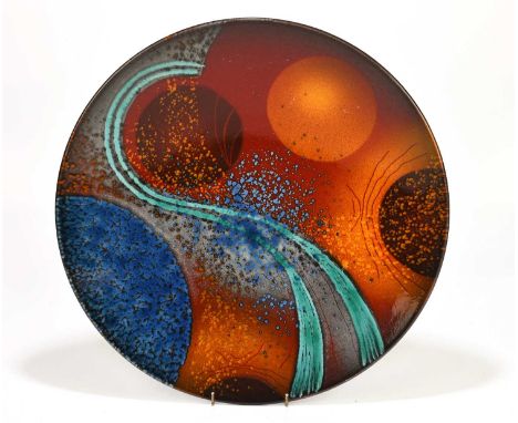 ALAN CLARKE; a large ceramic wall charger with stylised decoration on an orange/red ground, signed verso, diameter 40cm.Condi