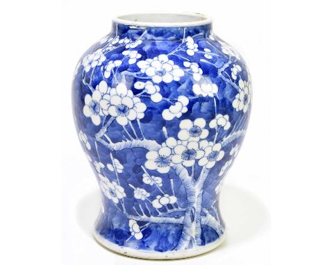 A 19th century Chinese blue and white porcelain vase painted with prunus flowers, height 22cm.Condition Report: Traces of pai