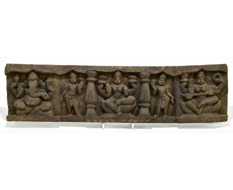 A 20th century Thai panel carved with various gods to include Ganesha, 14 x 53cm.