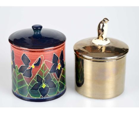 SALLY TUFFIN FOR DENNIS CHINAWORKS; a silver lustre preserve jar and cover, the finial modelled with a penguin, signed in gil