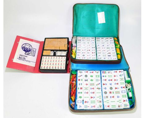 Three cased sets of Mahjong.