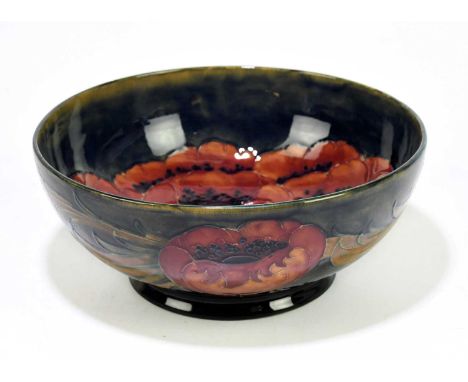MOORCROFT; a 'Poppy' pattern bowl, the interior decorated with a spray of five poppies, the underside with impressed marks an