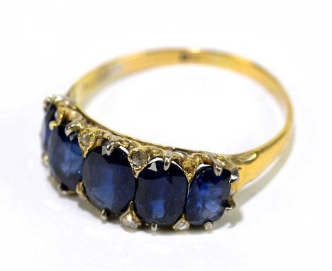 An 18ct gold and sapphire five stone ring, with five graduated oval sapphires, size R, gross weight 3g.