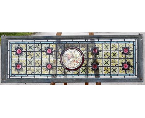 A late 19th century Aesthetic stained glass panel, decorated with two birds, flowers and pomegranates, 46cm x 139cm. 