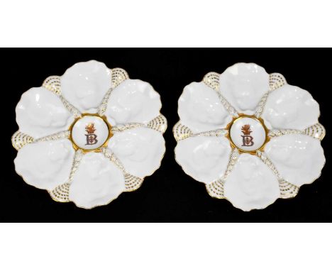 MANSARD; two French porcelain Oyster plates, with gilt highlights and central B below a motif, diameter 23cm (2).Condition Re