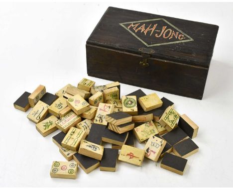 A Chinese hand painted bone Mahjong set, in stained wood box, length 20cm.