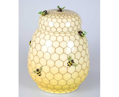 SALLY TUFFIN FOR DENNIS CHINAWORKS; a jar and cover, relief decorated with bees on honeycomb, impressed marks and no.1 to the