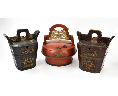 Two Chinese metal bound teapot caddies of tapering form with carved detail, height 32cm, together with a Chinese red lacquere