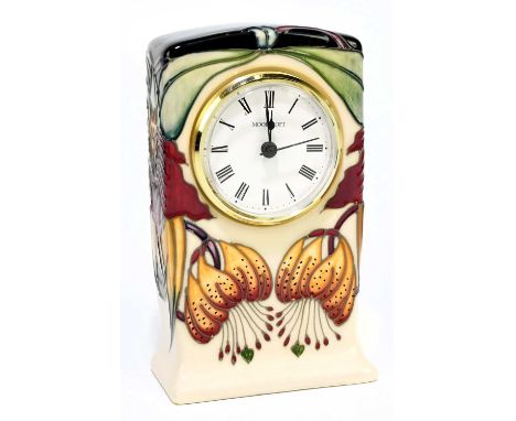 NICOLA SLANEY FOR MOORCROFT; a mantel clock decorated in the 'Anna Lily' pattern, height 15cm.Condition Report: Good conditio