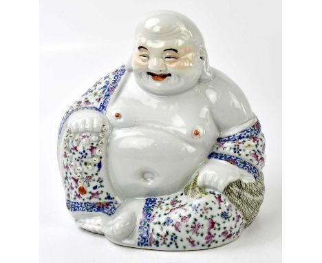 A Chinese Famille Rose porcelain model of a seated Buddha, his robe with floral decoration, impressed seal mark to the unders