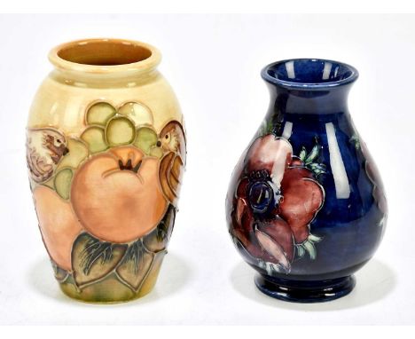 SALLY TUFFIN FOR MOORCROFT; a cylindrical vase decorated in the 'Finches Ochre' pattern, height 10.5cm, boxed, together with 