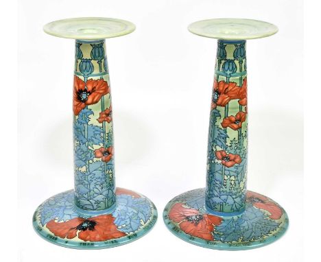 SALLY TUFFIN FOR DENNIS CHINAWORKS; a pair of large candlesticks of cylindrical form, tube lined with poppies, and inscribed 