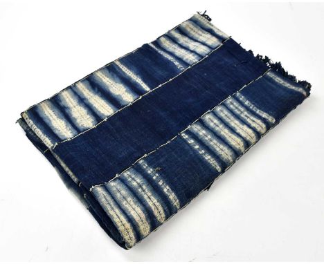 A mid century dyed and stitched blue textile panel, formed of six blue strips and five partially dyed strips simply stitched 