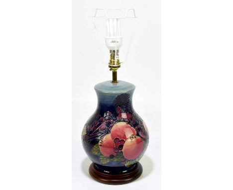 SALLY TUFFIN FOR MOORCROFT; a baluster shaped table lamp in the 'Finches' pattern on a blue ground, height (excluding fitting