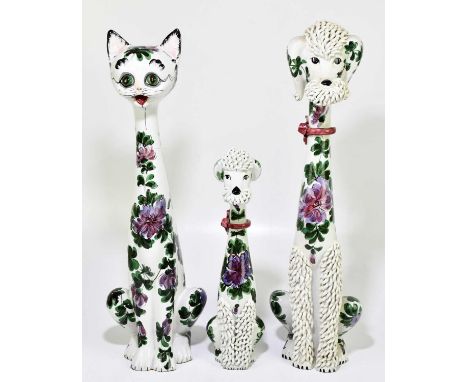 Two 1950s Italian ceramic Spaghetti poodles, hand painted with floral decoration, height of largest example 59cm, together wi