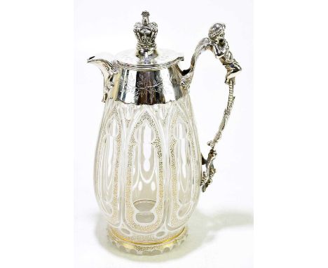 A 19th century Bohemian glass and silver plated claret jug, the cover with crown finial and resting cherub playing pipes to t