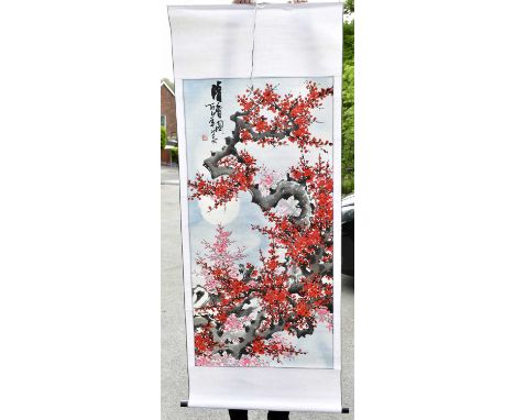 A large Chinese hand painted scroll decorated with prunus flowers in a winter landscape, 176 x 70cm.