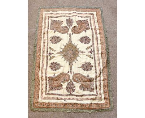 A Persian inspired needlework panel with paisley motifs to the corner spandrels and with fringe throughout, 144 x 98cm.Condit