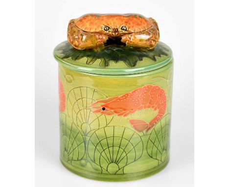 SALLY TUFFIN FOR DENNIS CHINAWORKS; a cylindrical jar and cover with crab finial, decorated with shells and shellfish, signed