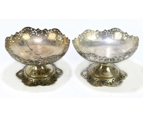 A pair of Persian white metal comports with niello and pierced decoration, height 13cm, diameter 21cm, combined weight 36.84o
