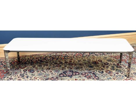 SOVET; an opaque glass and chrome rectangular coffee table, with rounded corners, on triform legs, height 38cm, length 159cm,