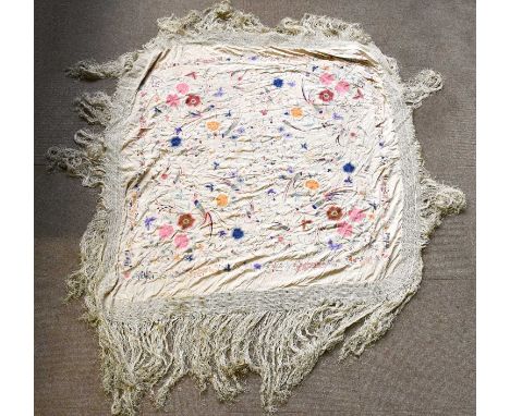 An early 20th century Chinese floral and bird embroidered silk panel with tassel fringe, approx. 140 x 140cm.