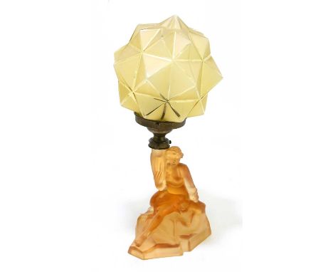 An Art Deco amber coloured glass lamp and shade, modelled as woman, height including sahde 40cm.Condition Report: Shade has a