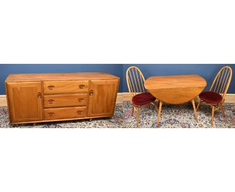 ERCOL; a light elm dining suite, comprising drop-leaf dining table, diameter 122cm, with four arch spindle back chairs, and t