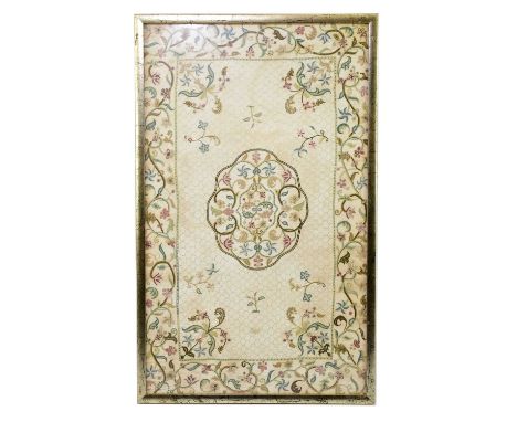 An Eastern needlework panel with floral decoration on a cream ground, 55 x 33cm, framed and glazed.