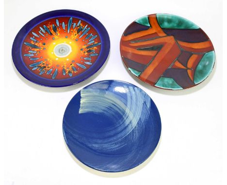 POOLE POTTERY; three circular wall chargers, including a limited edition example with stylised sunburst decoration, diameter 