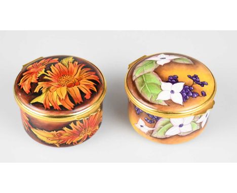 AMANDA ROSE FOR MOORCROFT; an enamel circular trinket box and cover decorated in the 'Sunflower' pattern, diameter 5.5cm, wit