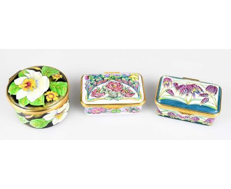 PHILIP GIBSON FOR MOORCROFT; a circular enamel trinket box and cover in the 'Magnolia' pattern, diameter 5.5cm, with two rect