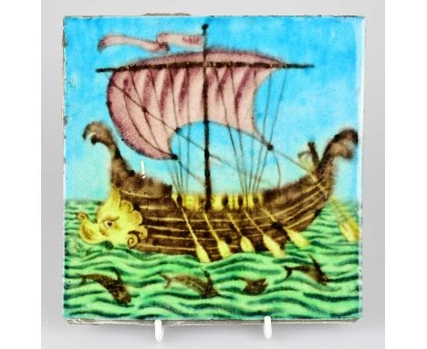 WILLIAM DE MORGAN; an Art Pottery tile painted with a galleon with five sailors, each with paddles with fish swimming below t