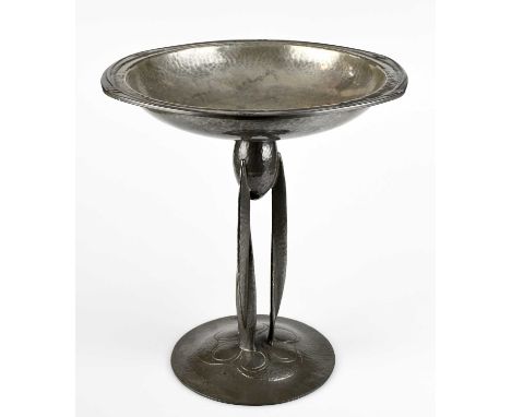 ARCHIBALD KNOX FOR LIBERTY & CO; a Tudric pewter comport with shaped circular top with embossed stylised detail and a planish