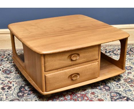ERCOL; a mid century light elm coffee table, with an arrangement of two drawers, on fitted castors, height 40cm, width 80cm, 