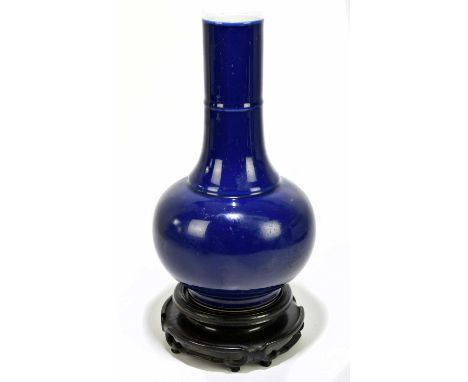 A late 19th century Chinese vase, decorated with an all over blue glaze, four character mark to base, height 34.5cm, on carve