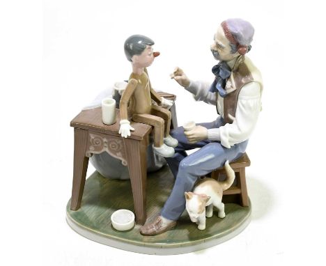 LLADRO; a ceramic group of Geppetto and Pinocchio, no.5396, height 24cm.Condition Report: The small water goblet from the tab