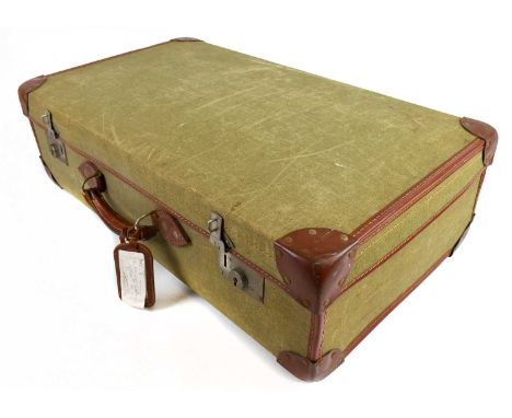 A military issue leather bound canvas suitcase, the interior stamped with the initials 'P.I', a military arrow and dated 1961