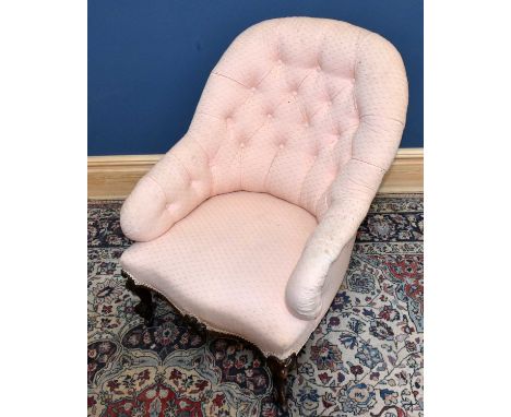 A Victorian carved mahogany nursing chair, with button back pink upholstery, height 87cm.