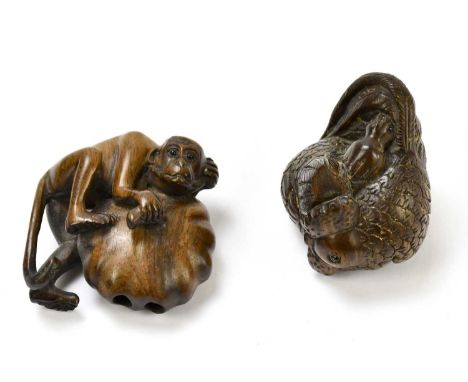 Two contemporary carved wooden netsuke, one modelled as a hen and chick, the second as a monkey holding a fruit, both signed 