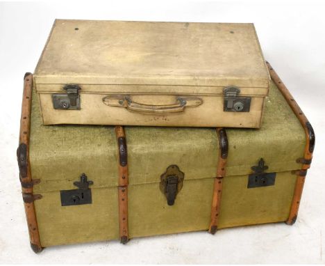 A green canvas and wood travel trunk, height 40cm, length 87cm, depth 50cm, together with two leather suitcases.
