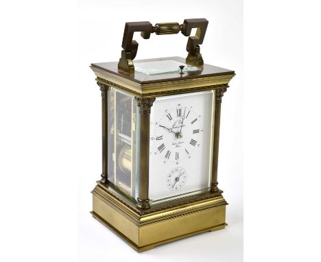 L'EPEE; a French lacquered brass repeating alarm carriage clock, the enamel dial with Roman numerals and subsidiary alarm dia