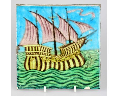 WILLIAM DE MORGAN; an Art Pottery tile painted with a four masted galleon ship, in shades of purple, blue, yellow, black and 