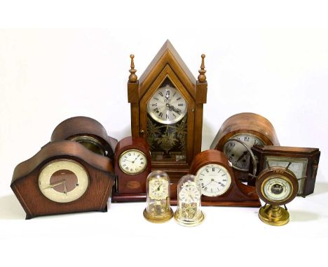 An assortment of 20th century mantel timepieces, anniversary clocks to include an Edwardian inlaid mahogany mantel timepiece,